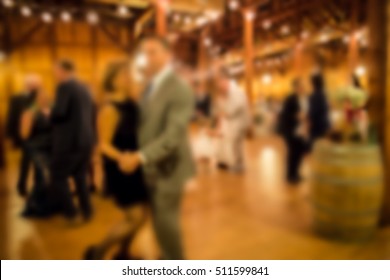 Defocused Blur Of Wedding Reception With Guests Dining And Dancing