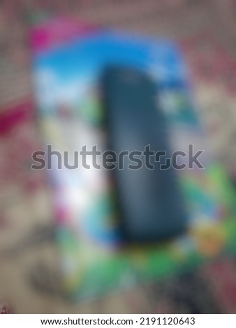 Defocused or blurred abstract background of a book for elementary student placed under the plaatic pencilcase
