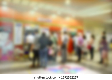 Defocused Blurred People Buying Subway Ticket