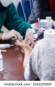 Defocused Blurred Photo Of Mass Vaccination In Yogyakarta, Indonesia March, 24th 2022. Regular Blood Checks Can Be Done In A Clinic, Health Laboratory Or Hospital. Blurry Image.