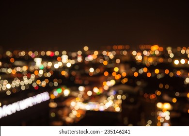 Defocused Bokeh Of Light In City On Yellow Background