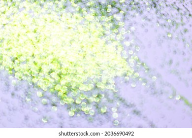 Defocused, Celebratory Background. Green Glitter Isolated On White.