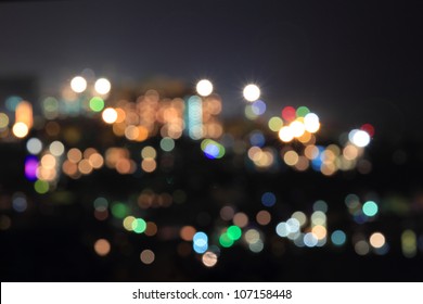 Defocused City With Lights Of Different Colors In The Night