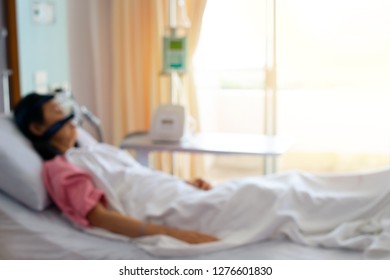 Defocused Of Cpap Machine Is Treating Senior Patient Woman Wearing Cpap Mask Sleeping Smoothly Without Snoring In Hospital Room.
Obstructive Sleep Apnea Therapy,blurred For Background.