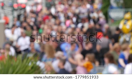 Defocused crowd of people, road intersection crosswalk on The Strip of Las Vegas, USA. Anonymous blurred pedestrians on walkway in crowded urban downtown. Unrecognizable american citizens in sin city.