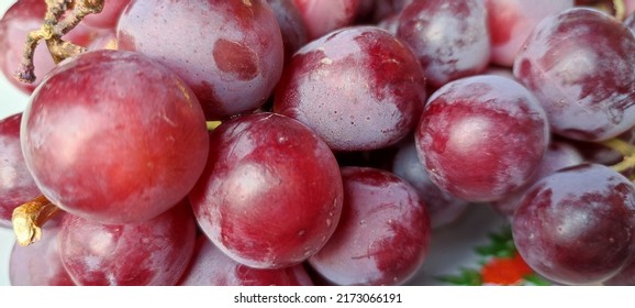 Defocused Dark Red Grapes Background