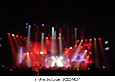 Defocused entertainment concert lighting on stage, blurred disco party.