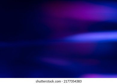 Defocused glow overlay. Fluorescent light leak. Sci-Fi illumination. Blur neon navy blue magenta pink color flare flecks on dark modern abstract background. - Shutterstock ID 2177354383
