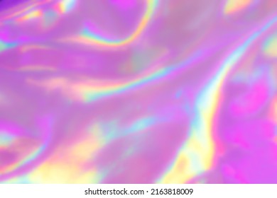 Defocused Holographic colours wrinkled pearlescent foil. Blurred Holography abstract background in pink colors. Holographic iridescent rainbow fabric abstract background. - Shutterstock ID 2163818009