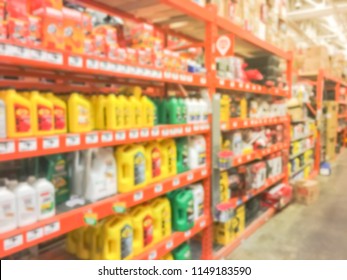 Defocused Home Improvement Retailer Store With Racks Of Lubricant, Automotive, Towing, Garage Organization. Blurred Image Background Of Large Hardware Store In America