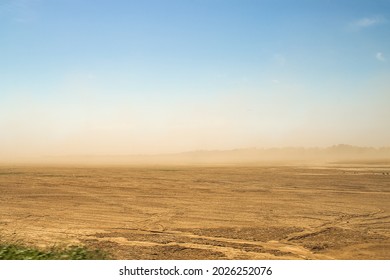 Defocused image. Desert sandstorm. Dust and sand in the air. 