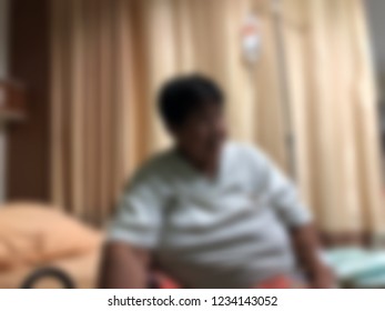 Defocused Image, Elderly Patients Lying On Bed Waiting For The Doctor In Emergency Room, At Hospital. Selective Focus.