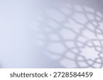 Defocused of Islamic shadow background with soft geometric mosque pattern on bright white surface, Suitable for Ramadan, Eid Mubarak, and Muslim greeting designs