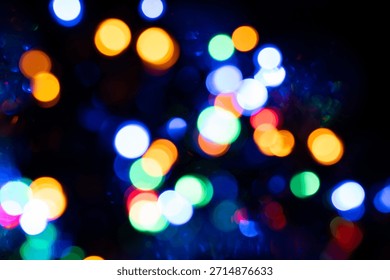 Defocused light effect bubbles light effect with multiple different colors in dark dramatic scene