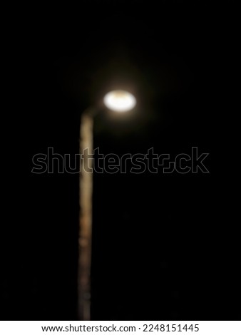 defocused light poles in the dark night