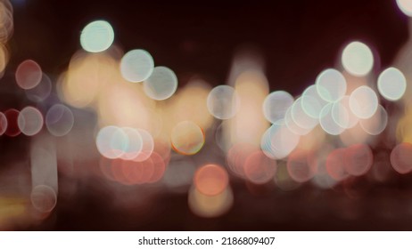 Defocused Night Street Lights. Bokeh Street Lights From Cars In The City.