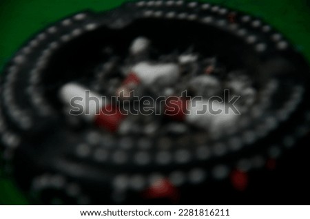 Defocused objects of cigarretes in the ashtray.
