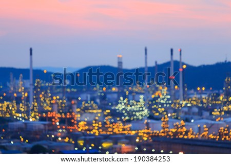 De-focused oil refinery industry plant in twilight evening