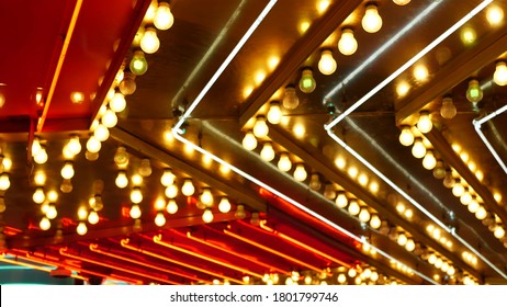 Defocused old fasioned electric lamps glowing at night. Abstract close up of blurred retro casino decoration shimmering, Las Vegas USA. Illuminated vintage style bulbs glittering on Freemont street.