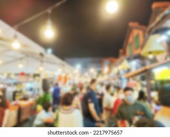 Defocused People Shopping At Food Festival Background.