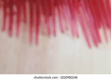 Defocused Photo Of Red Plastic Fork