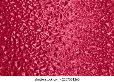 Defocused photography of glass texture,colored in tredny red color of 2023. - Shutterstock ID 2237581263