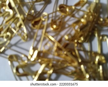 Defocused Picture Of Golden Pin 