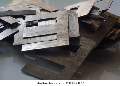 Defocused Pile Of Ferromagnetic Metal Core For High Energy Efficient Transformer.  Selective Focus, Shallow Depth Of Field.