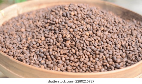 defocused, robusta coffee beans after roasted are dark brown 