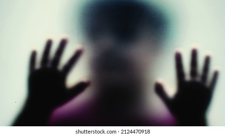 Defocused Shot Of A Child Behind Glass Feeling Stuck Abusive Concept