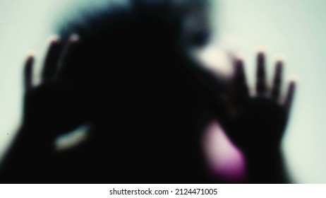 Defocused Shot Of A Child Behind Glass Feeling Stuck Abusive Concept