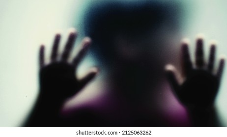 Defocused Shot Of A Child Behind Glass Feeling Stuck Abusive Concept