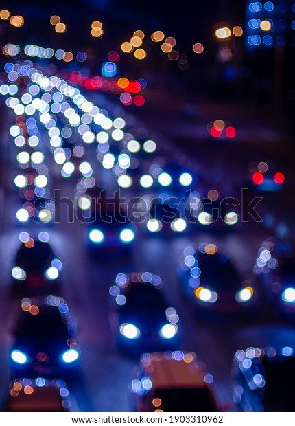 Defocused shot of\
colorful traffic\
lights