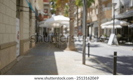 Similar – Image, Stock Photo A street scene in the center of Madrid during the day in front of the Gran Via metro station!