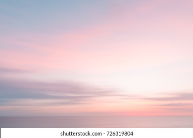 Defocused sunrise sky and ocean nature background with blurred panning motion. - Powered by Shutterstock