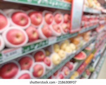 Defocused Supermarket Shelves Full Of Fruits. Fruit Consumer Products Placed On The Shelf