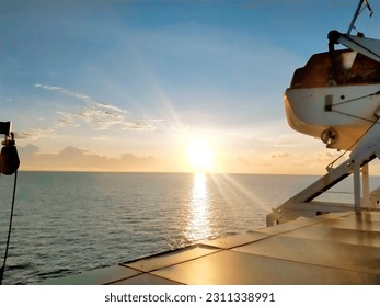 defocused view of the sunset in the middle of the sea
 - Shutterstock ID 2311338991
