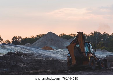 Deforestation. Global human problem. Preparation to build new road instead green forest. Tractor rest after working