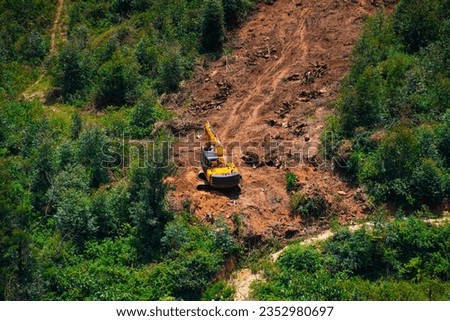 Deforestation of India rainforest. Environmental problem and soil erosion. Destruction of forest by machinery. forest destroyed for Tea plantations in Kerala, India         