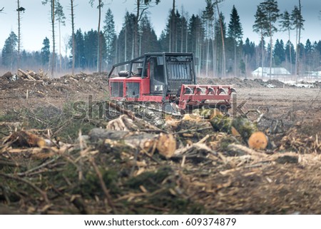 Deforestation. Wood chipper making wood chips