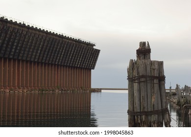 Defunct Pier On Lake Superior Next To An Old Iron Ore Dock