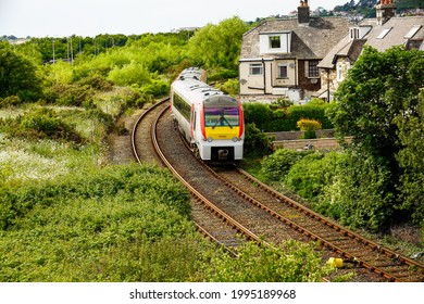 Deganway Wales UK June 2021 Diesel Train Traveling On Track Close To Domestic Homes