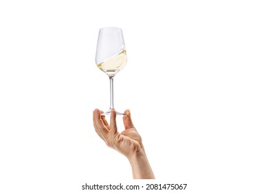 Degustating delicious wine. Cropped image of male hand holding glass with white wine isolated over white background. Concept of alcohol, drink, party, degustation, holiday. Copy space for ad
