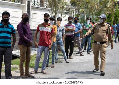 Dehradun, Uttarakhand/India- August 02 2020: Pandemic Coronavirus Covid-19, Lockdown In India, Police Helping People, Maintains Social Distancing. 