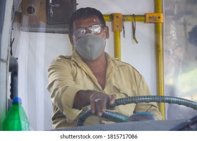 Dehradun, Uttarakhand/India - September 08 2020 A Driver Driving A Bus, Wearing Face Mask.