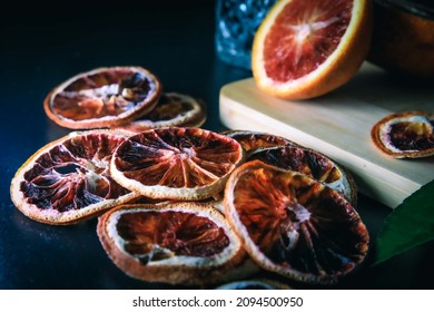 Dehydrated Citrus Fruit Oranges Blood Orange And Lemon Dragon Fruit Cocktail In A Glass With Ice Spash Tonic Black Background Product Photography Citrus Wheels Nightlife