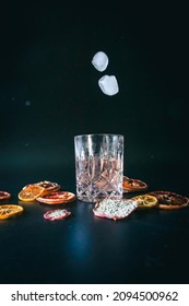 Dehydrated Citrus Fruit Oranges Blood Orange And Lemon Dragon Fruit Cocktail In A Glass With Ice Spash Tonic Black Background Product Photography Citrus Wheels Nightlife