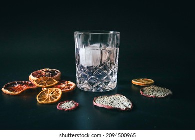 Dehydrated Citrus Fruit Oranges Blood Orange And Lemon Dragon Fruit Cocktail In A Glass With Ice Spash Tonic Black Background Product Photography Citrus Wheels Nightlife