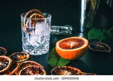 Dehydrated Citrus Fruit Oranges Blood Orange And Lemon Dragon Fruit Cocktail In A Glass With Ice Spash Tonic Black Background Product Photography Citrus Wheels Nightlife