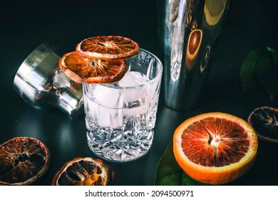 Dehydrated Citrus Fruit Oranges Blood Orange And Lemon Dragon Fruit Cocktail In A Glass With Ice Spash Tonic Black Background Product Photography Citrus Wheels Nightlife